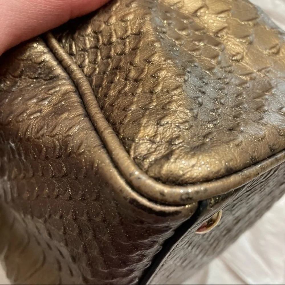 Coach gold embossed leather mini barrel bag
